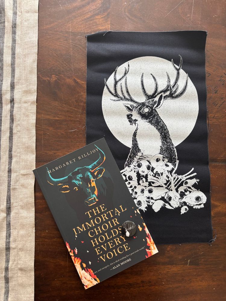 Loot and the book the Immortal Choir Holds Every Voice by Margret Killjoy 