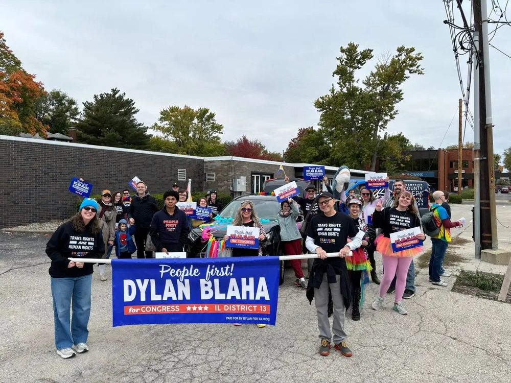 A large group photo of people walking for Dylan Blaha at a local pride parade.