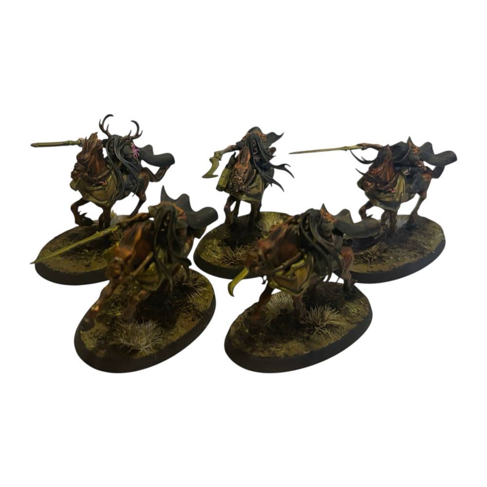 Witches on horseback with swords drawn.