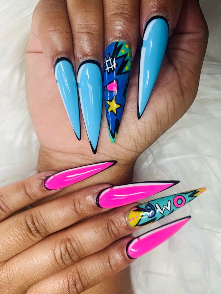Photo of hands with long pointy nails pop art colors pink, teal, and baby blue 