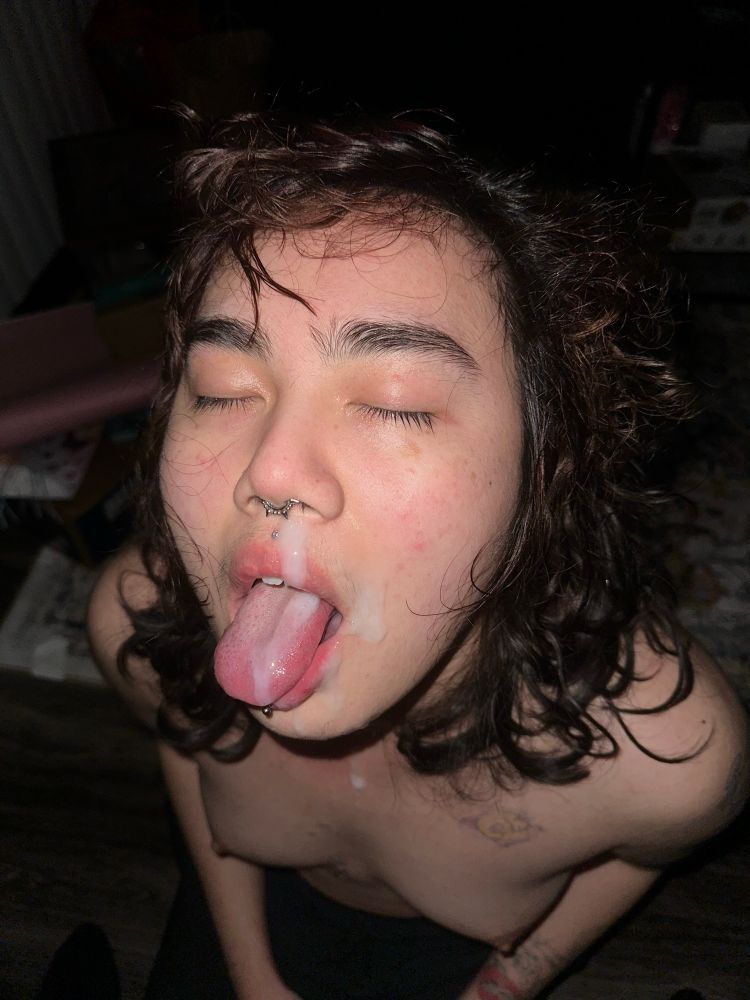 Picture of K's face covered in cum, his tongue sticking out and he's topless