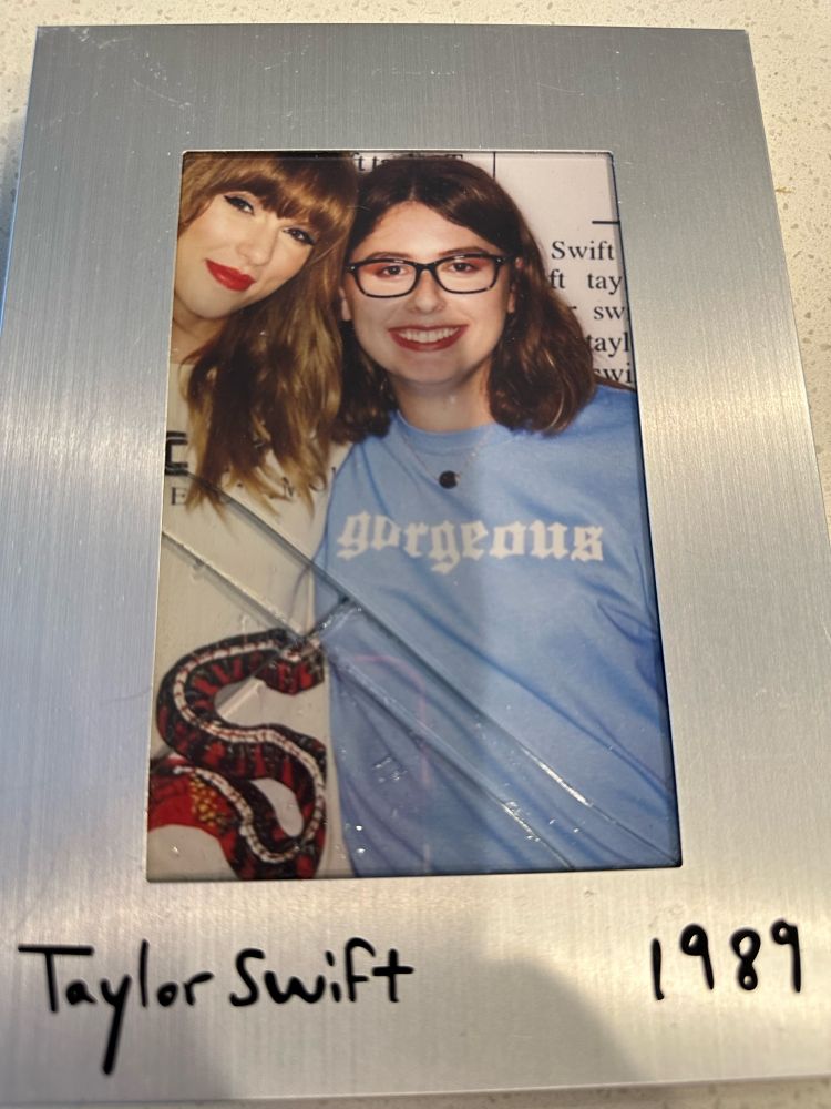 A cracked 1989 frame with a photo of me and Taylor from the reputation era.