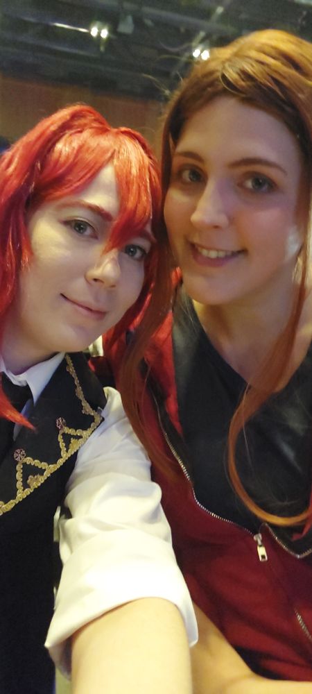 Two Persons wearing cosplays and having a great time