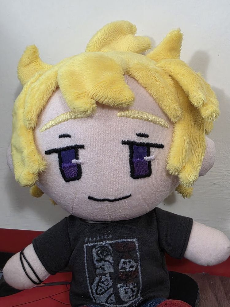 Photo of plush Morty (Rae edition) sitting, no bandana