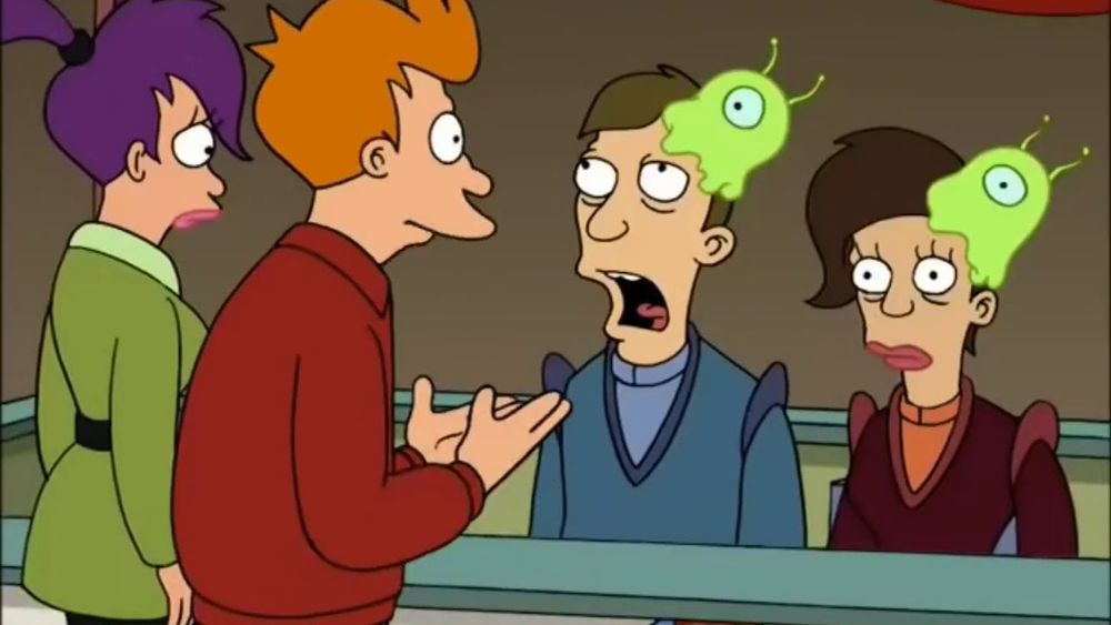 Fry and Leela (of Futurama) fame converse with two sickly people with large green slugs attached to their heads.