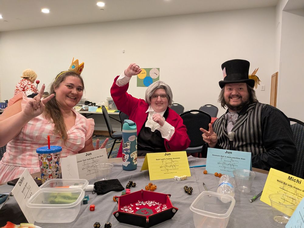 Three people in costume playing an RPG where they each have a timeline variant of the same character who is a reformed assassin in a fantasy, horror and sci-fi world.