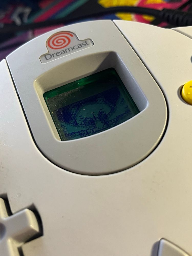 a closeup of my dreamcast controller. dr. robotnik’s face is visible on the VMU screen in the center