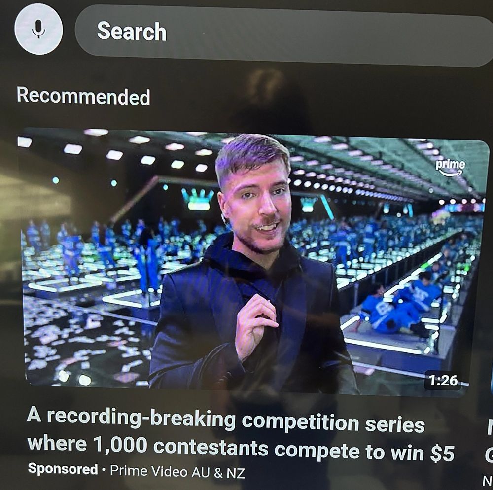 Sponsored YouTube recommendation with the title "A recording-breaking competition series where 1,000 contestants compete to win $5"