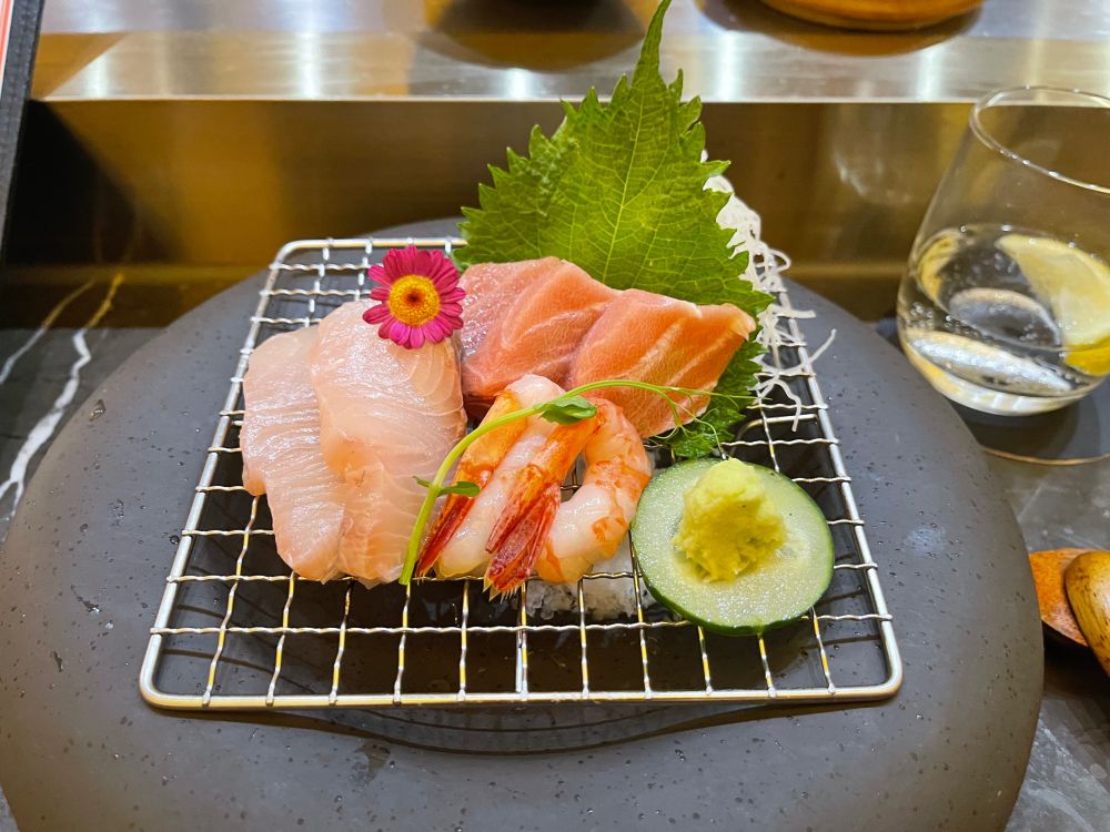 Sashimi course with yellowtail, fatty tuna, and ama ebi