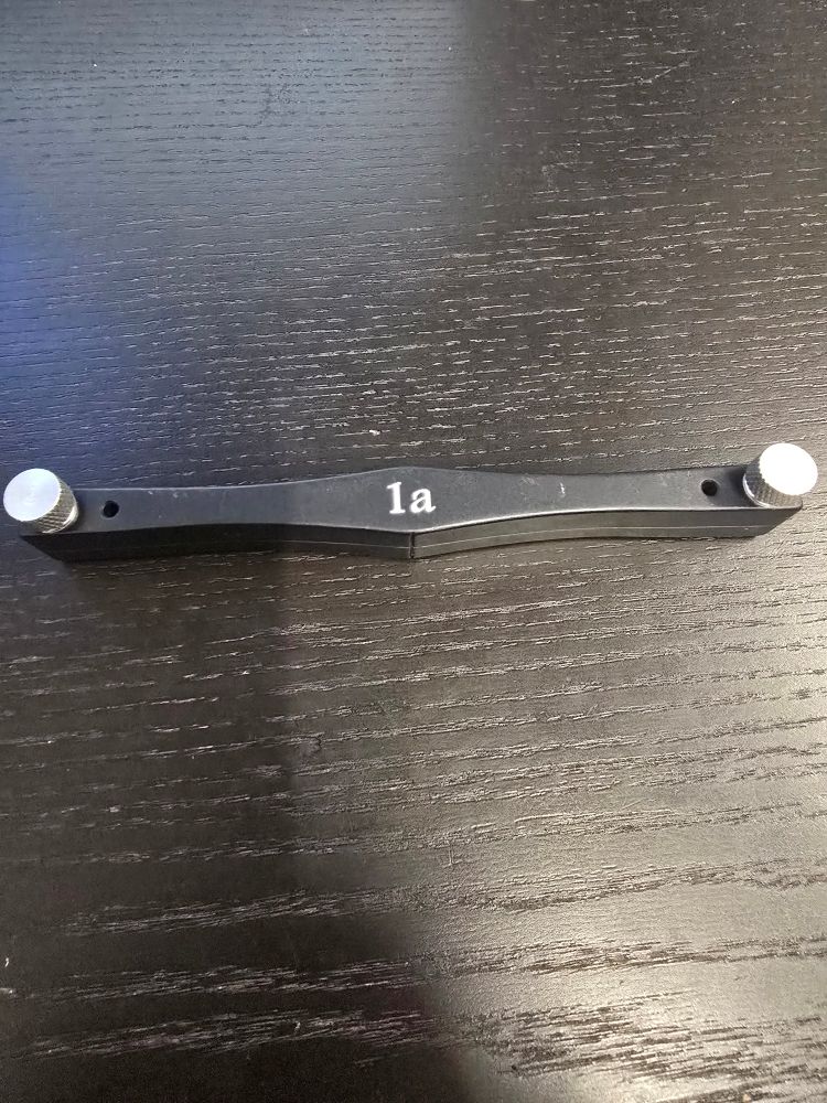 A bassoon reed shaper on a desk.