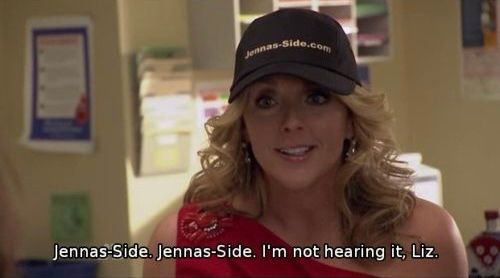 Jenna Maroney wearing the Jenna’s Side hat, saying “Jenna’s-Side, Jenna’s-Side, I’m not hearing it, Liz.”