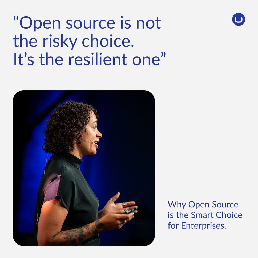 A woman with curly hair and tattoos speaks passionately on stage, lit by dramatic blue lighting. Above her, a quote reads: “Open source is not the risky choice. It’s the resilient one.” In the corner, text says: “Why Open Source is the Smart Choice for Enterprises.”