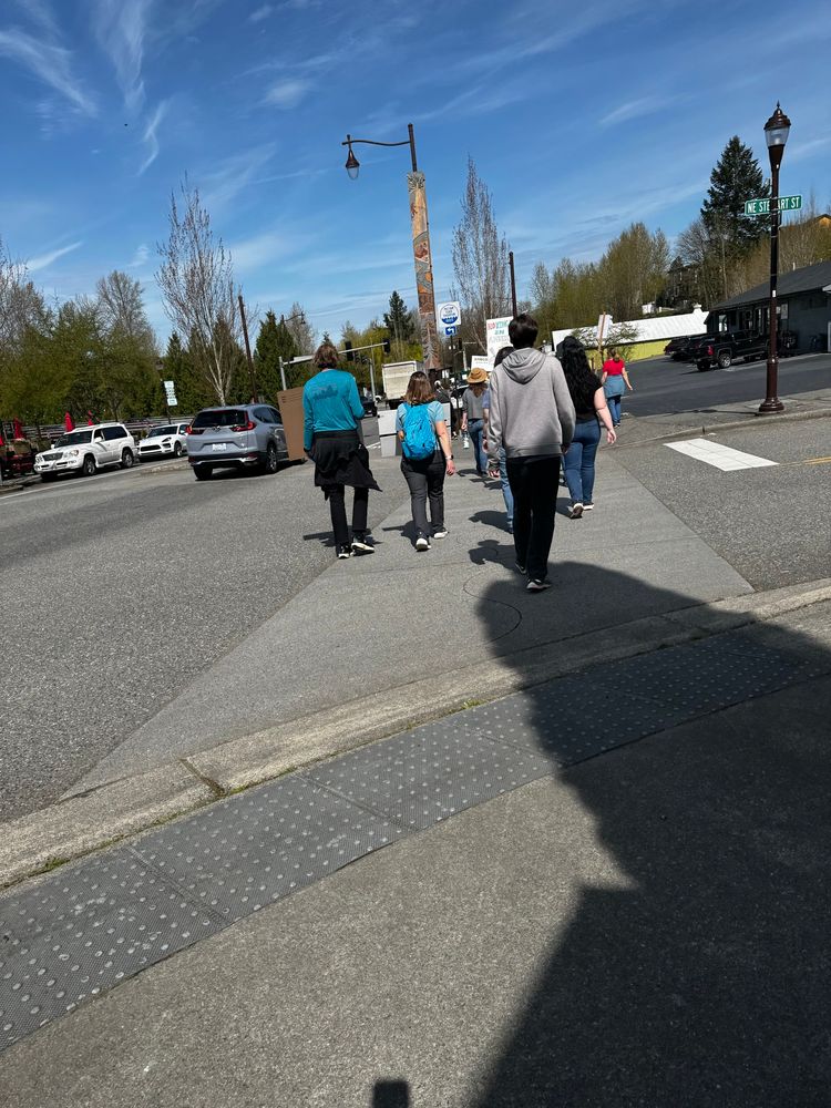 Protesters walking with signs and without

