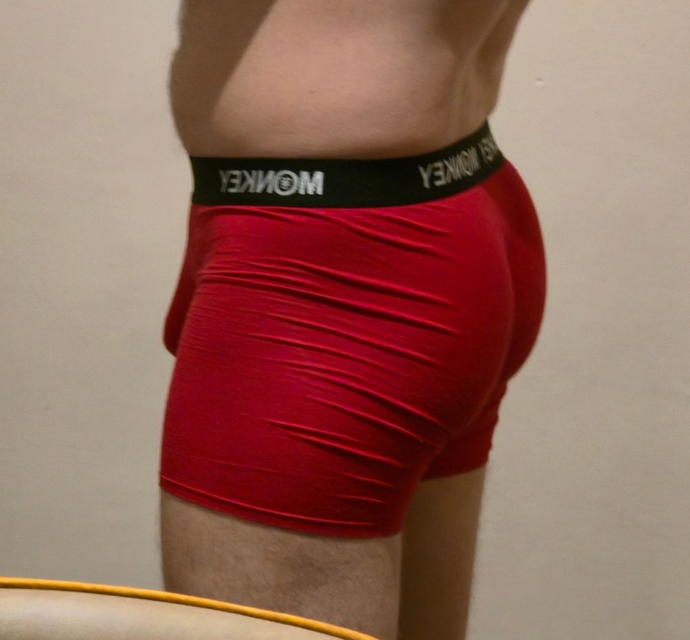 A basic side shot of a butt in red underwear in an offer for humpday