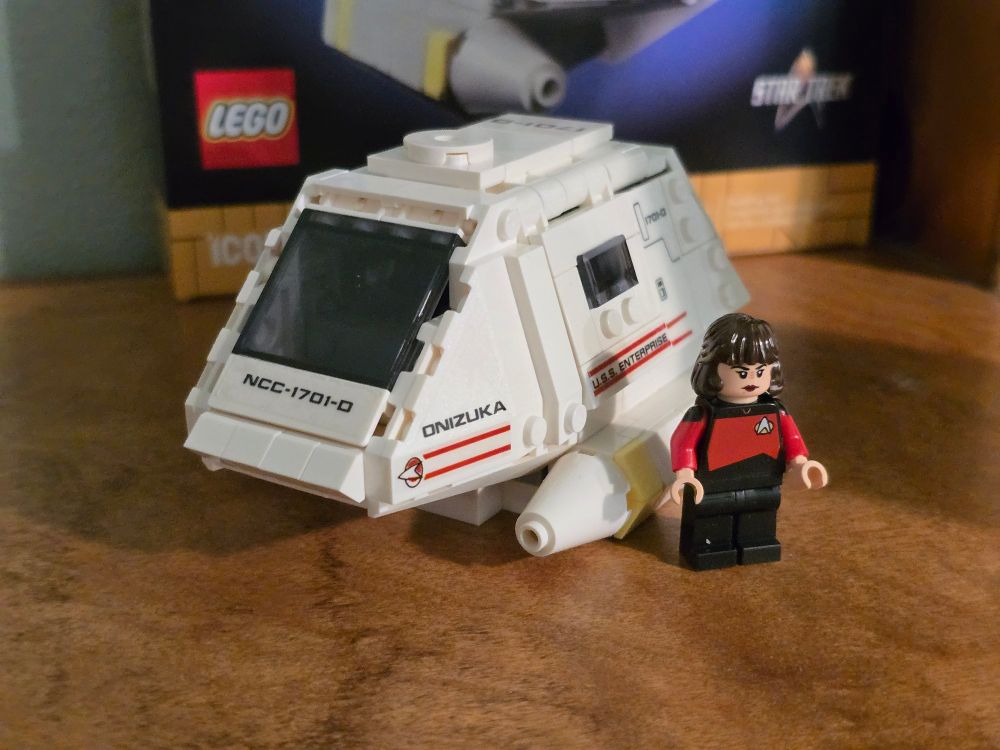 A LEGO set of a Next-Generation-era type 15 shuttlepod with a Ro Laren minifigure