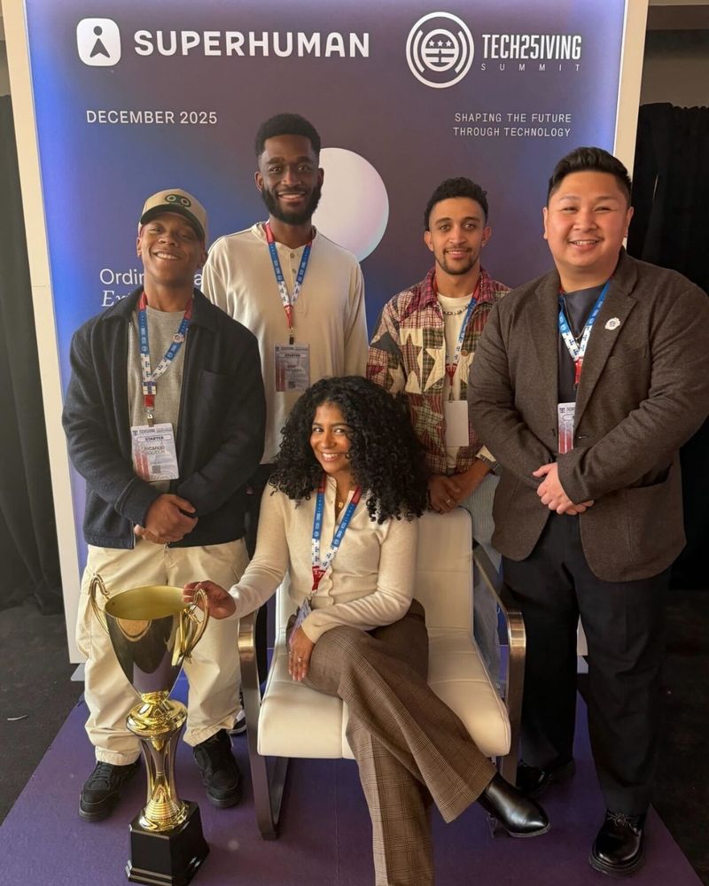 5 of our Resilient Changemakers posing in front of a Techsgiving poster.