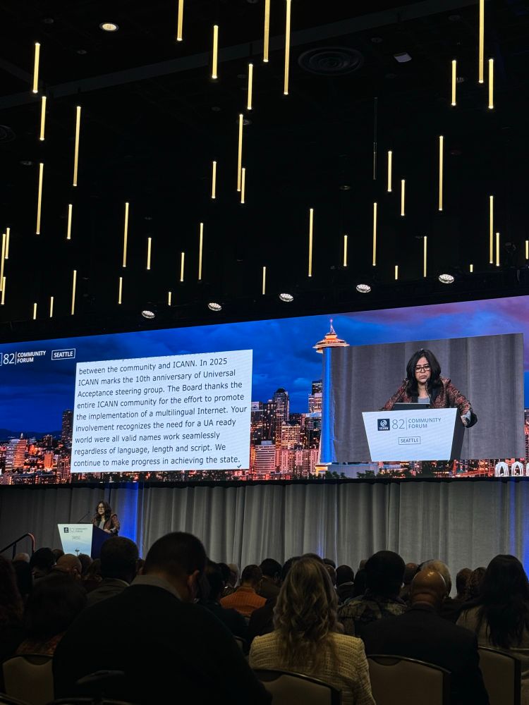 Picture of a presenter at the opening ceremony of ICANN 82, saying: “The board thanks the entire ICANN community for the effort to promote the implementation of a multilingual Internet. Your involvement recognizes the need for a UA (Universal Acceptance) ready world where all a valid names works, regardless of language, length and script.”
