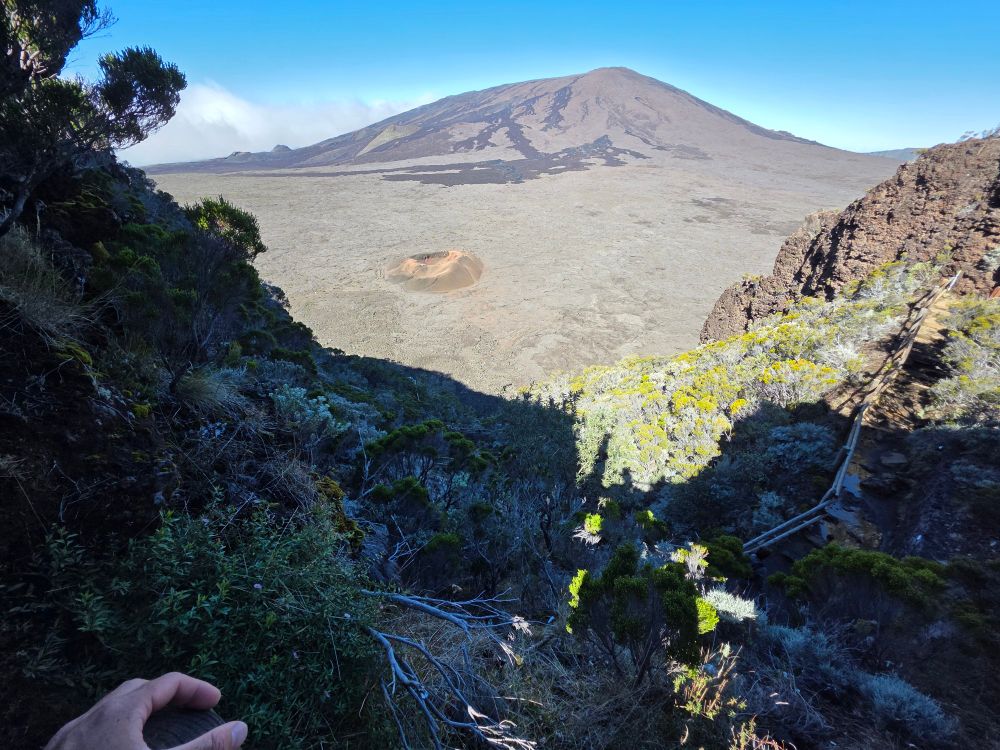 A viewpoint of Reunion's volcano the piton de la fournaise one of the most active volcano in the world. The photo shows the path to take to go down in the volcanic field surrounding the principal crater
