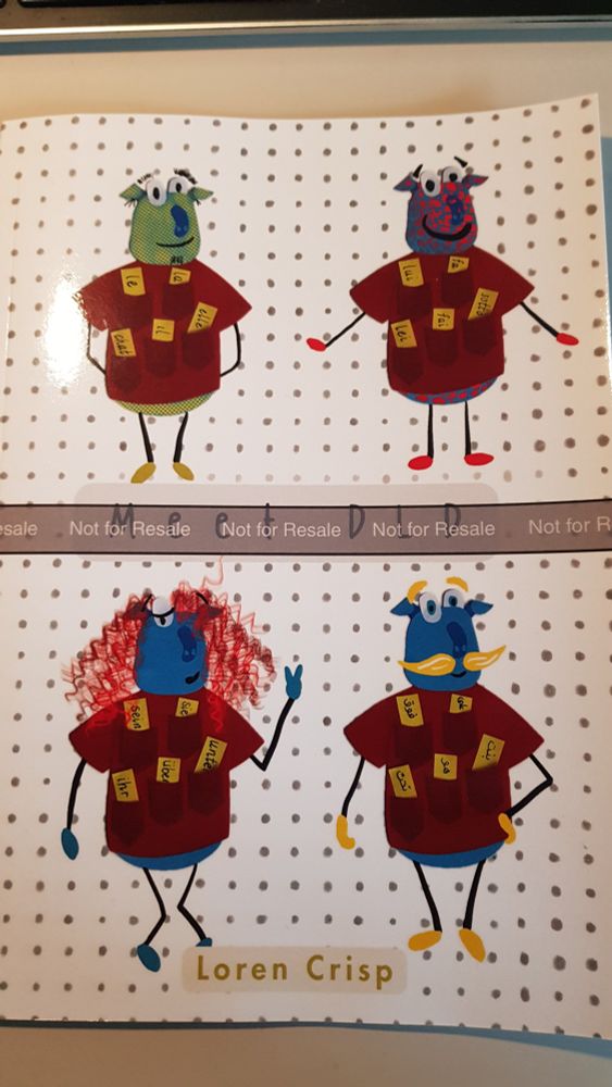 Cover of a children's book, with 4 cartoon type characters all wearing red clothing. Title of the book is obscured. Author's name is Loren Crisp