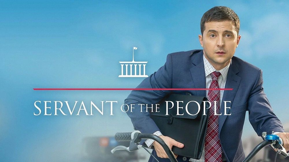 title card for Servant of the People starring Volodymyr Zelenskyy. he is wearing a suit and grasping a briefcase as he drives a bike in front of security vehicles