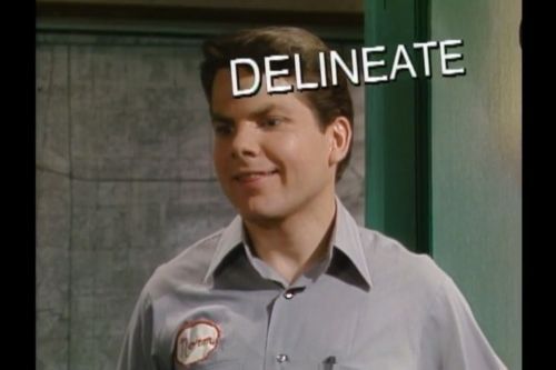 Bruce McCullough in a Kids in the Hall Sketch. He is wearing a workshirt and an intrigued expression, and the word "DELINEATE" is floating around his head