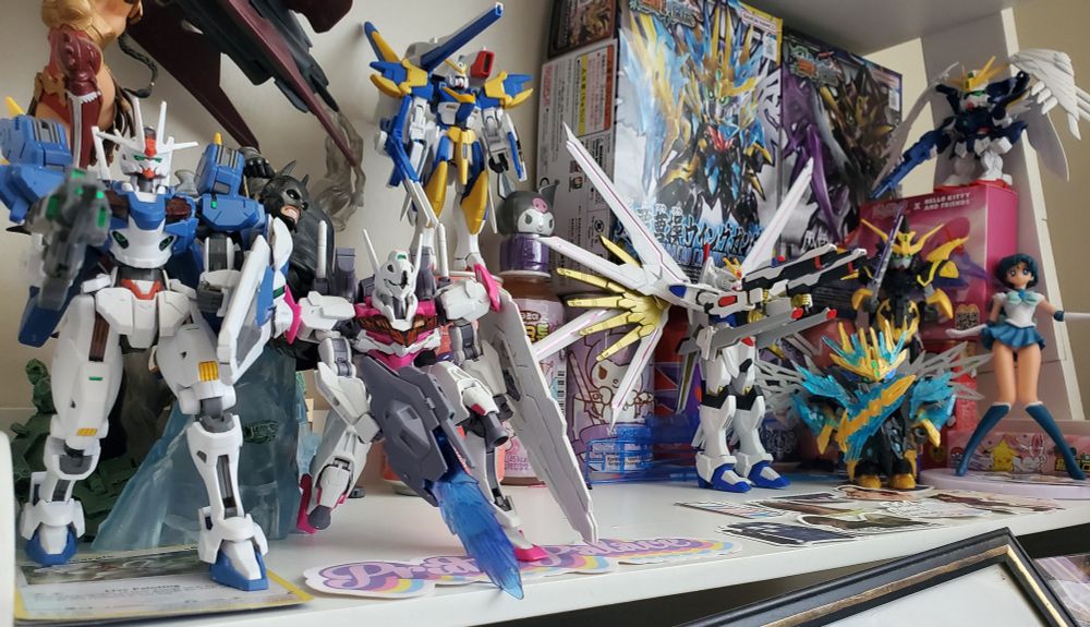 Left to right; Gundams Aerial, Lfrith, V2 Assault Buster, Mighty Strike Freedom, SD Sangoku Wing and Deathscythe, SD EW Wing Zero, Sailor Mercury 