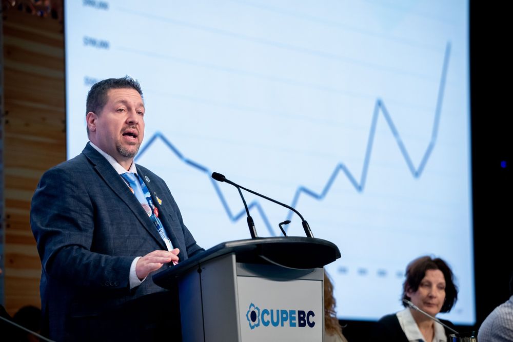 Tony Rebelo at the podium delivering his speech to convention delegates