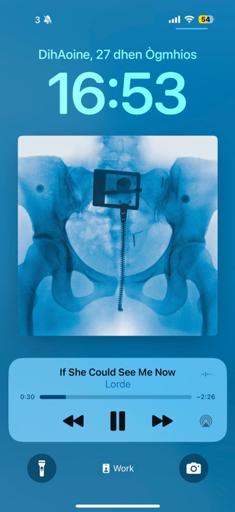 Screenshot of a phone lock screen showing the new Lorde album, with the song "If She Could See Me Now" playing