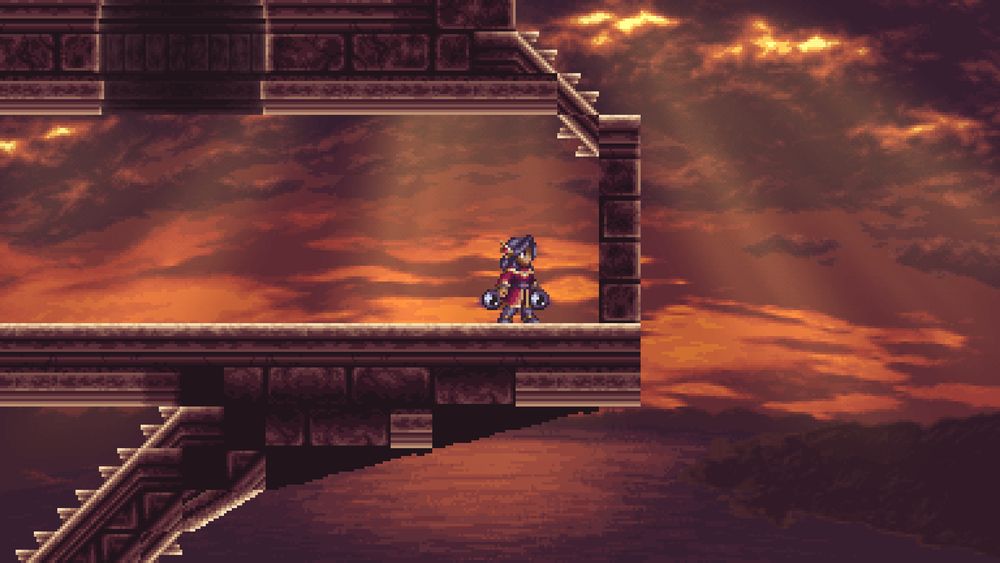 A woman in a red robe standing in front of a brick wall in an empty corridor overlooking a view of the sea during sunset.