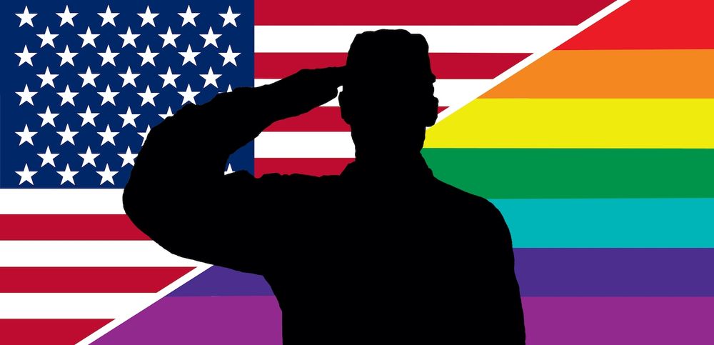 Black silhouette of a service person saluting over half a USA flag and half a rainbow flag 