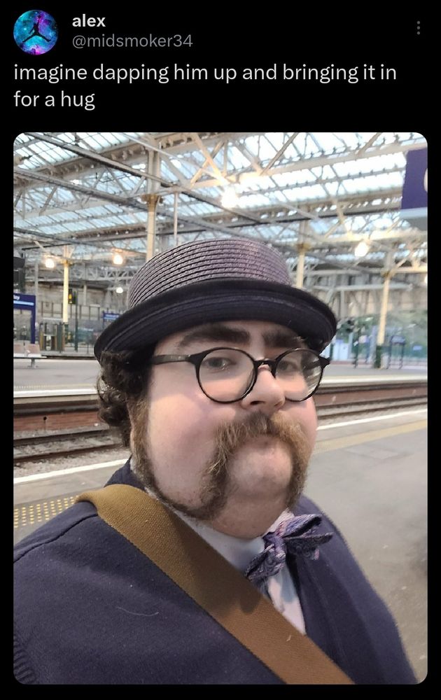 Picture of human pet guy in a train station