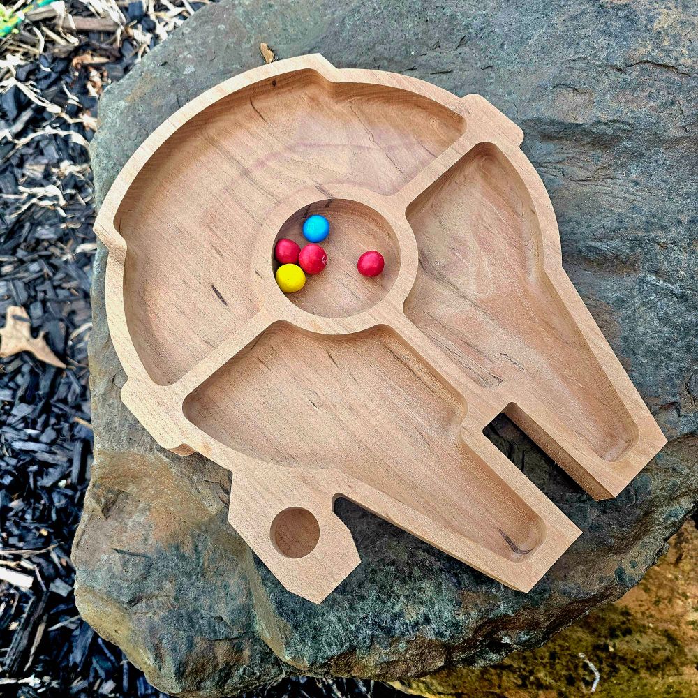 A candy tray shaped like a spaceship. 