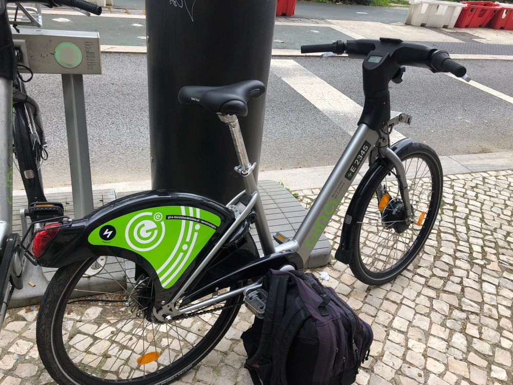 A shared bike on the side walk in Lisbon 