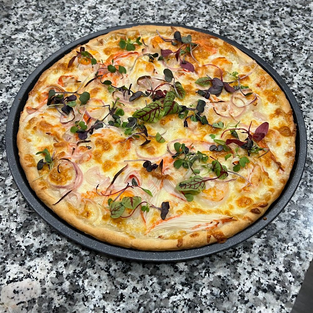 Seafood Pizza w/ Shrimp, Langostino  Lobster, Imitation crab (the good kind they use at sushi restaurants), & Shallot topped with rainbow micro greens. 