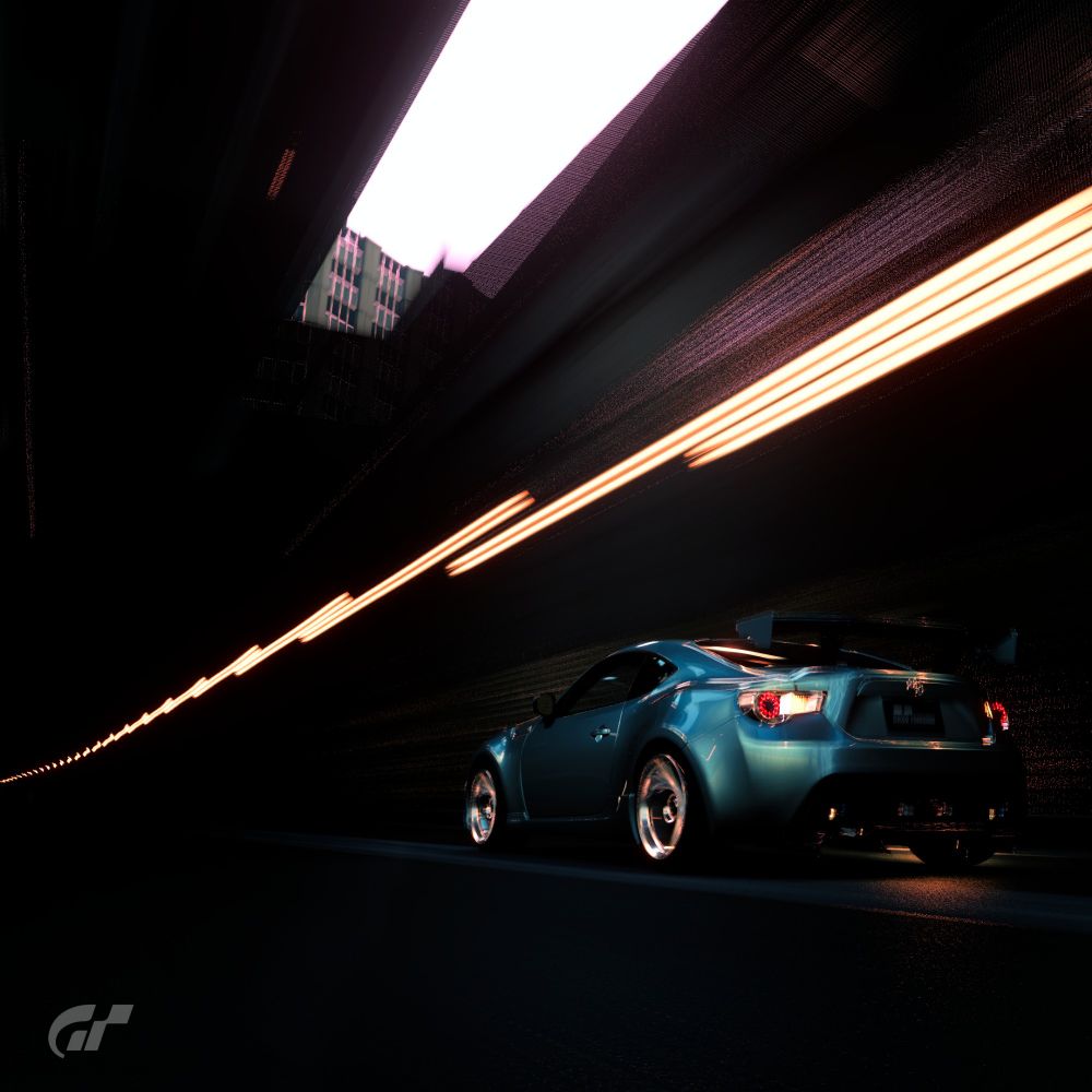 rear 3/4 shot of the 86 in motion, this one is from a bit further away and is panned at an upward (50-60° maybe?) angle so you can see the gap in the top of the tunnel (not sure how to phrase it lol.) the rear-left of the car is being illuminated by said gap, its very pretty!!!