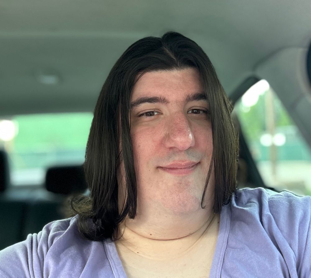 A selfie of me after getting my first femme haircut🥰