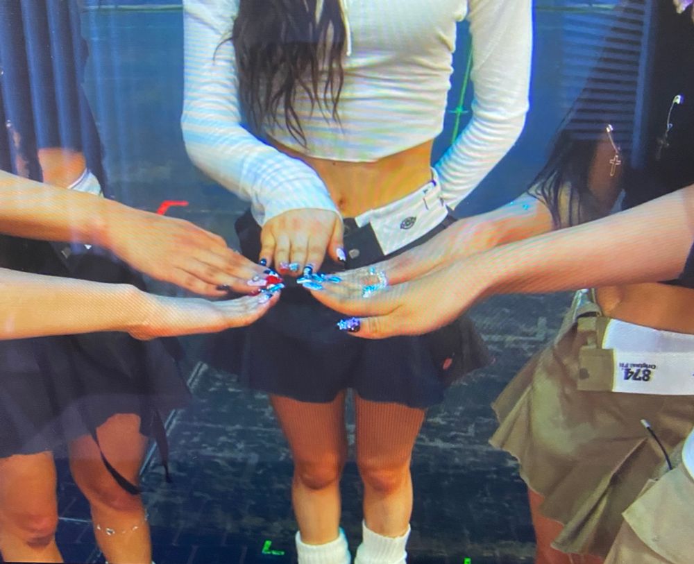 NewJeans showing off their nails at Lollapalooza 2023 