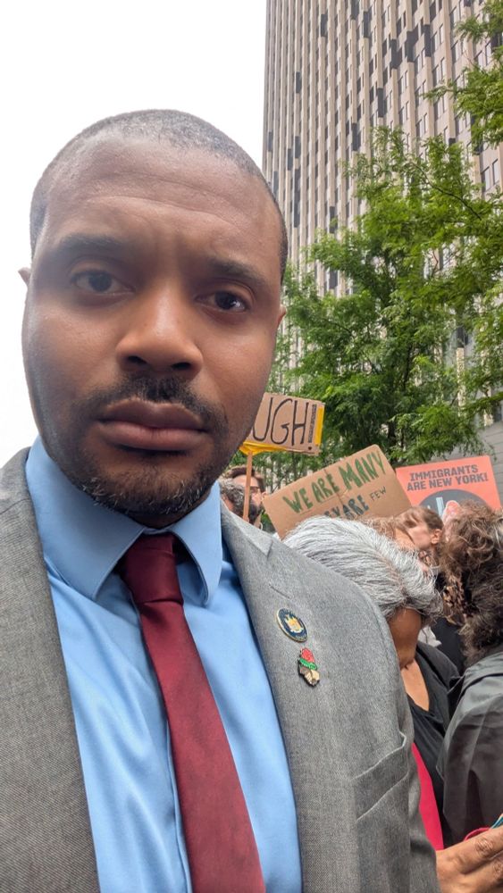 Sen. Jabari Brisport standing with ICE protesters