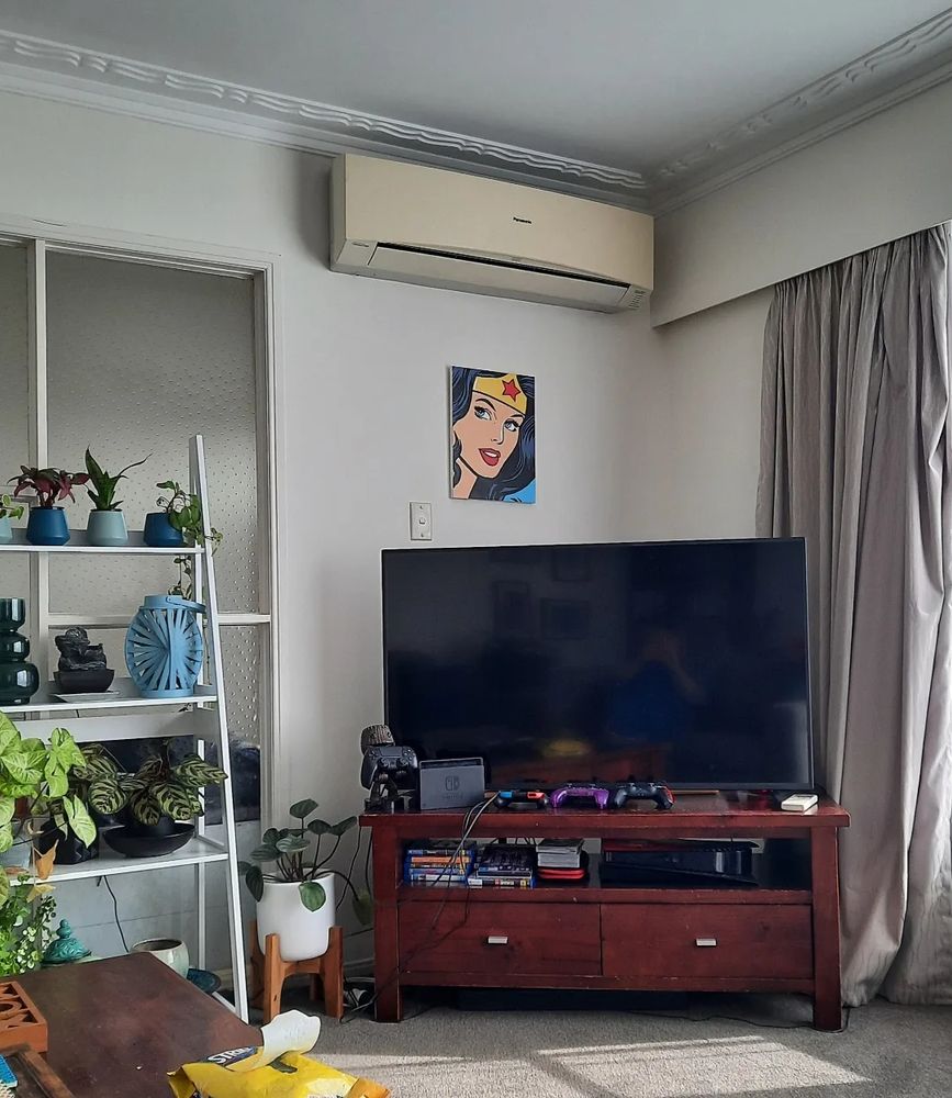 Photo of corner of a room with the Wonder Woman painting hanging