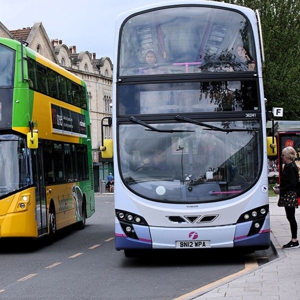 Two double decker buses on a road in Weston-super-Mare.