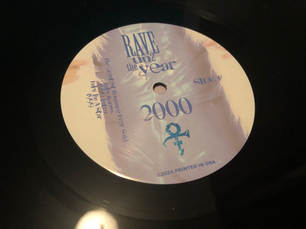 A close-up of the label of side F of Prince’s Rave Un2 The Year 2000 LP on vinyl 