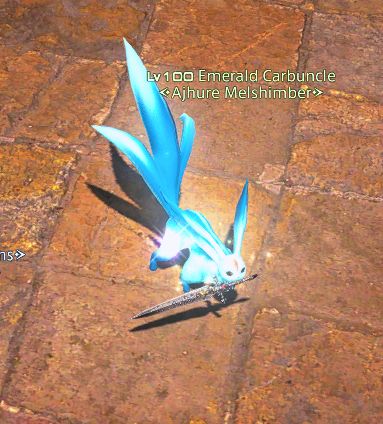 My emerald carbuncle is holding a begemmed dagger in his mouth.