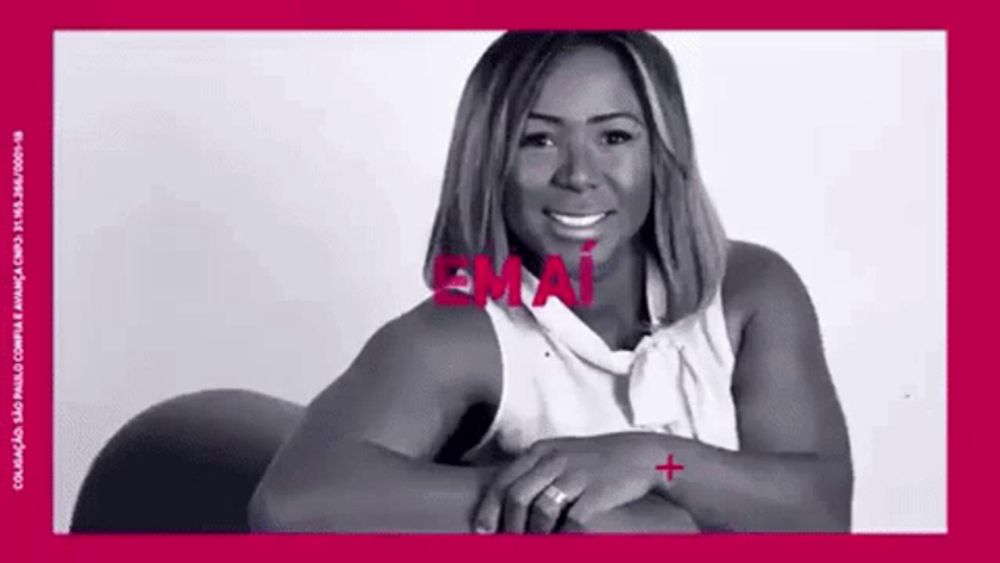 a woman is smiling in a black and white photo with the word emai written on it .