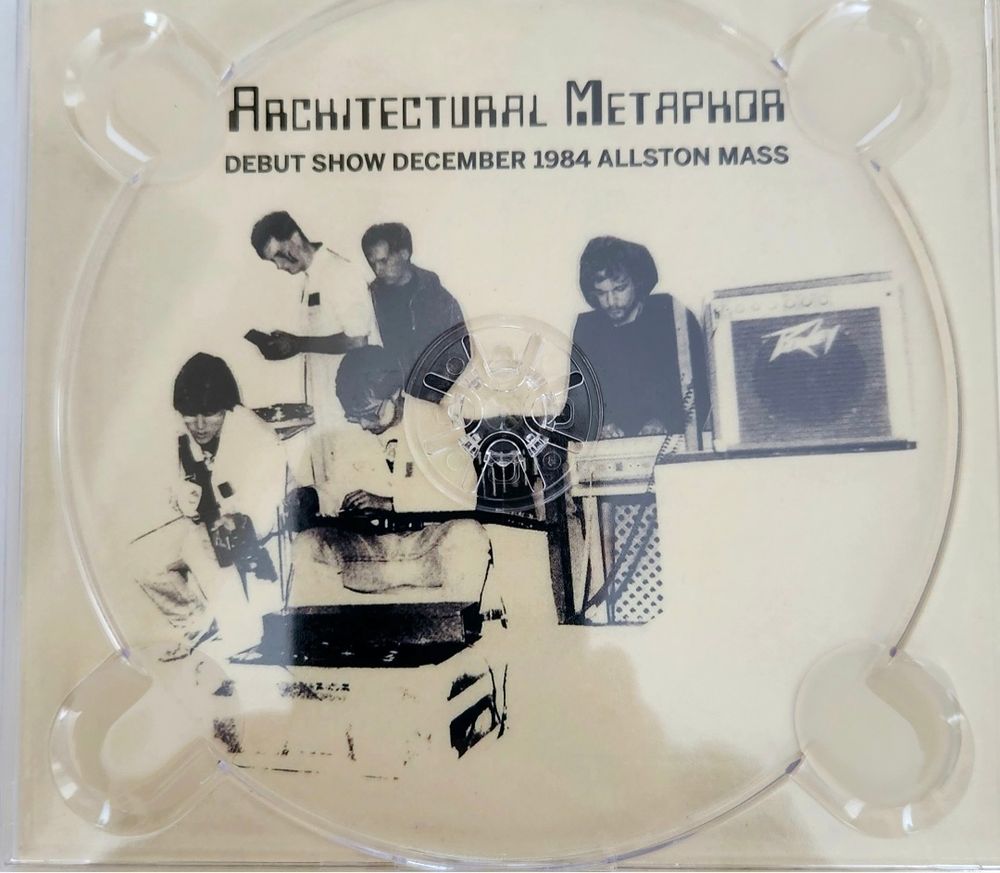 Black and white of similar photo as first shown as the backing of a cassette disk. With the title Architectural Metaphor debut show, 1984 Allston MA