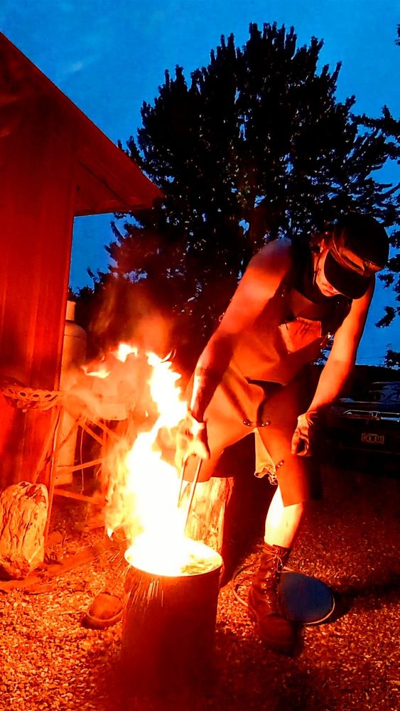 Me quenching a hammer, my arm enwreathed in flame
