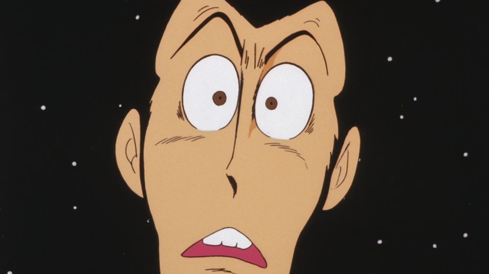 A very handsome man surrounded by stars, looking shocked.