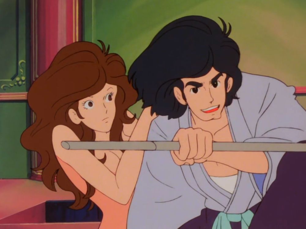 The world's sexiest babe and a handsome samurai. The samurai is holding a sheathed sword. The world's sexiest babe is very much naked.