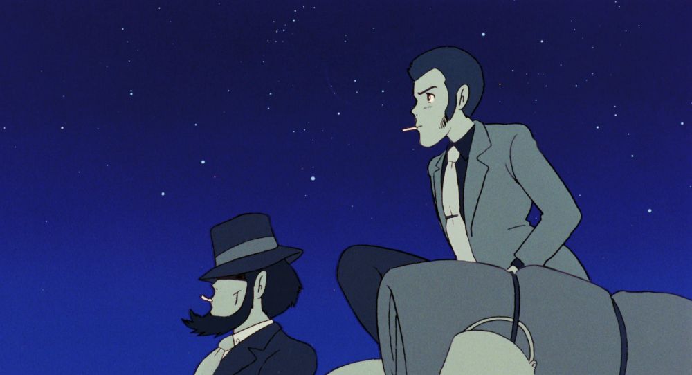 Two handsome men sitting on their Fiat 500, with a starscape behind them. Both are smoking cigarettes.
