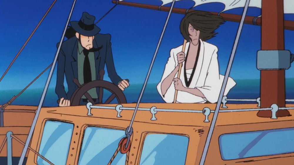 Two handsome men on a sailboat. The one on the left has a beard and fedora and is at the wheel. The one on the right is a samurai holding a sword. Neither looks happy.