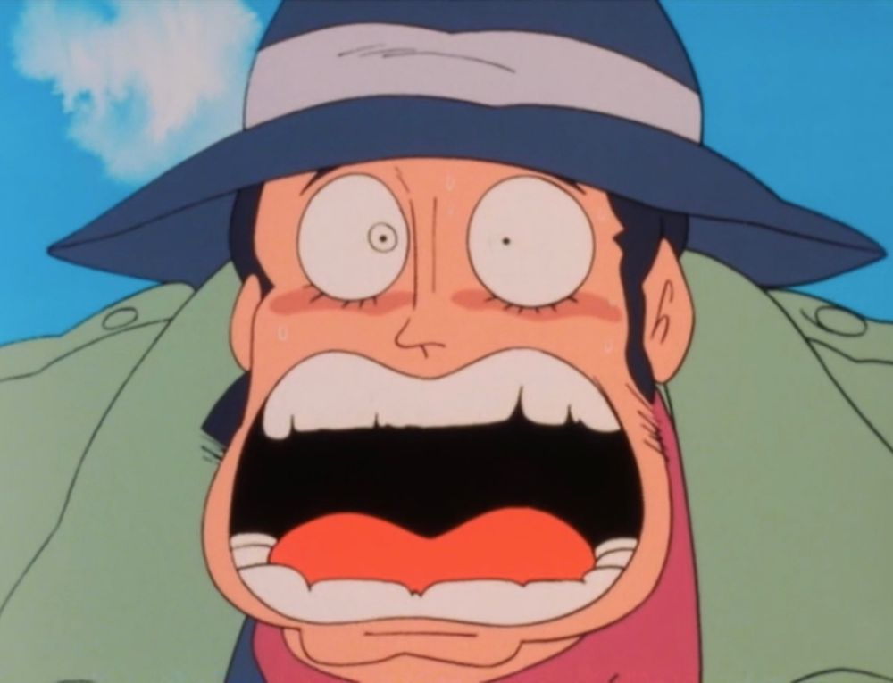A man with a prominent chin looking incredibly shocked